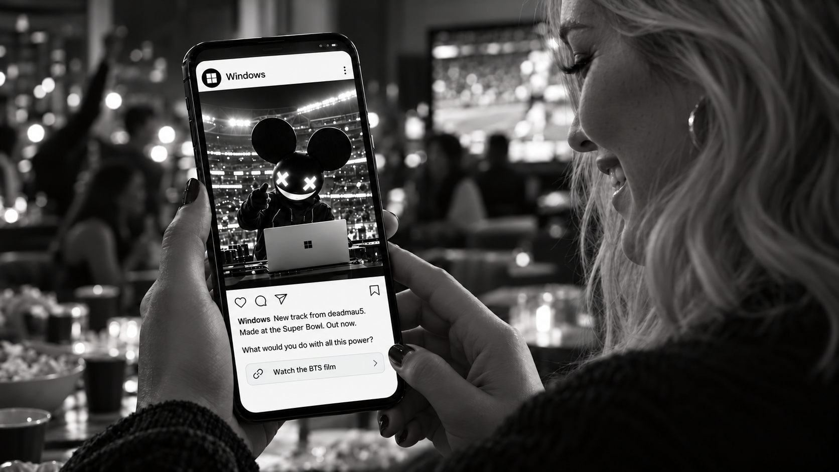 Concept: a blonde fan at a Super Bowl party views a Windows Instagram post announcing deadmau5’s new track made at the game. The post asks, What would you do with all this power? and invites her to watch the BTS film.